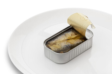 Opened sardine preserve fish can on a white plate. Isolated on a transparent background