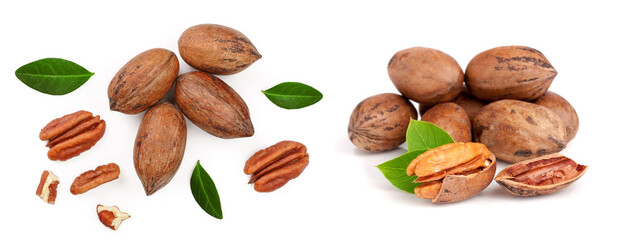 pecan nut decorated with green leaves isolated on white background. Top view. Flat lay