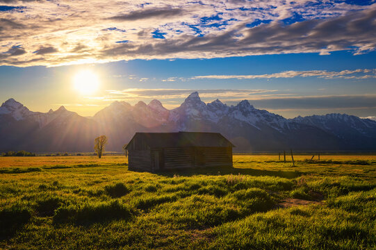 Sunset over a historic shed at Mormon Row in Grand Teton National Park, Wyoming
