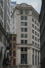 Historic and modern minimalistic building facade architecture in downtown Boston, Massachussetts with Art Deco elements, Pilars, domes, churches, skyscraper skyline contrast detail window view