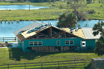 Hurricane Ian destroyed house in Florida residential area. Natural disaster and its consequences