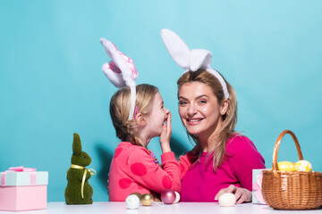 Family easter. Ester for mother and daughter. Mom with child are preparing for Easter. Mother and...