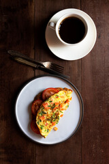 Egg breakfast food omelet has vegetable in plate on wood table. - obrazy, fototapety, plakaty