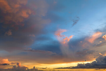 White fluffy cumulonimbus clouds forming before thunderstorm on evening sky. Changing stormy...