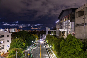 Dramatic sky after sunset over quiet street and tall buildings