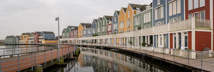 Foto auf Acrylglas Panorama of famous colorful wooden houses by the Rietplas lake in Houten, Province Utrecht, The Netherlands © Milos