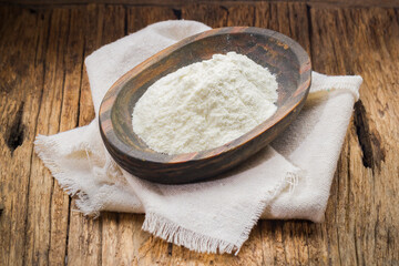 milk powder in wooden container, cow's milk