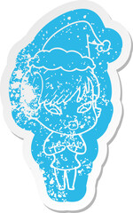 cartoon distressed sticker of a woman wearing santa hat