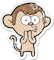 distressed sticker of a cartoon hooting monkey