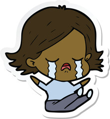 sticker of a cartoon girl crying