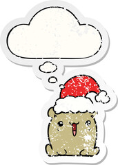 cute cartoon bear with christmas hat and thought bubble as a distressed worn sticker
