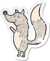 retro distressed sticker of a cartoon waving wolf
