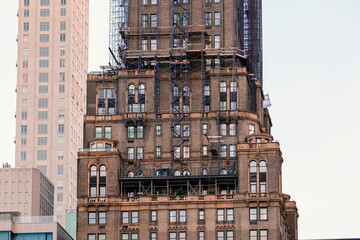 Fototapeta premium Architecture Building Skycrapper Urban office downtown sky facade windows residential apartment rental leasing sale concrete wall bricks construction tourism