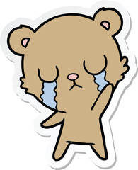 Obraz premium sticker of a crying cartoon bear waving