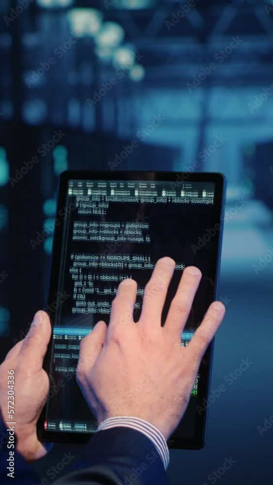 Poster vertical video: support specialist checking server computers on tablet, planning mainframe system ba