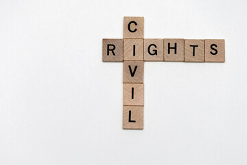 civil rights spelled out using square wood letter tiles isolated on white background, politics, social issues of United States, equality for all