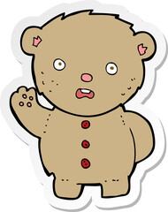 sticker of a cartoon unhappy teddy bear