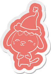 happy cartoon  sticker of a dog wearing santa hat