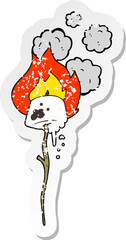 retro distressed sticker of a cartoon toasted marshmallow