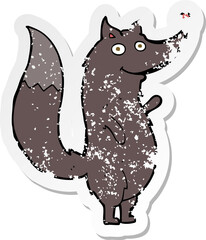 retro distressed sticker of a cartoon waving wolf