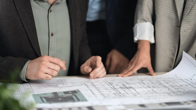 Architect building construction corporate team meeting colleagues discuss blueprint draft plan