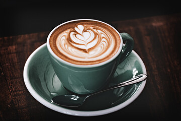 Close up of the cup of cappuccino vintage style