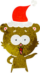laughing teddy  bear retro cartoon of a wearing santa hat
