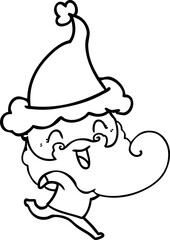 happy bearded man wearing santa hat