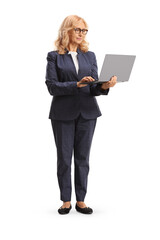 Mature professional woman standing with a laptop
