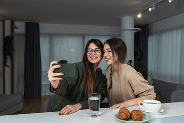 Younger sister visiting her older sister in her new apartment she moved into after divorcing her...