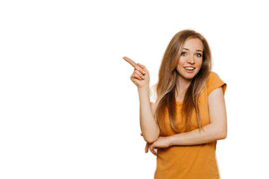 Cute cheerful redhead young woman wears orange casual clothes pointing aside at empty space by index finger, smiles broadly, discount time is on, over transparent background. Happy people concept. - Powered by Adobe