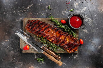 Grilled and smoked ribs with barbeque sauce. Delicious barbecued ribs. Food recipe background....