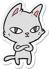 Obraz na płótnie Canvas sticker of a cartoon cat staring
