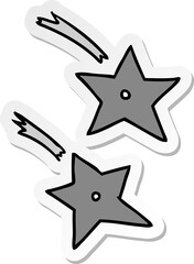 sticker cartoon doodle of ninja throwing stars