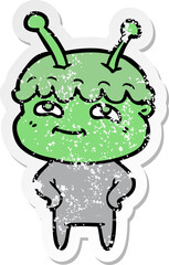 distressed sticker of a friendly cartoon spaceman