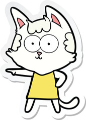 sticker of a happy cartoon cat in dress pointing