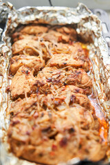 Baked chicken breast. Baked in foil with onions and seasonings. Home cooking. Healthy food, cooked without oil and salt. 