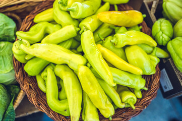 Green peppers in a basket (grocery store)