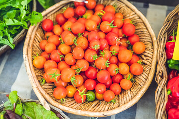 Cheery tomatoes on a basket (grocery store)