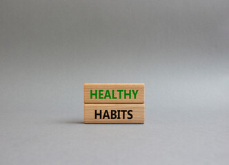 Healthy habits symbol. Concept word Healthy habits on wooden blocks. Beautiful grey background. Business and Healthy habits concept. Copy space