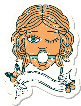 grunge sticker with banner of winking female face with ball gag