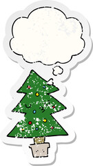 cartoon christmas tree and thought bubble as a distressed worn sticker