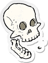 retro distressed sticker of a cartoon laughing skull