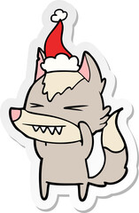 angry wolf sticker cartoon of a wearing santa hat