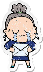 distressed sticker of a cartoon old woman crying with letter
