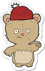 sticker of a cartoon bear in hat