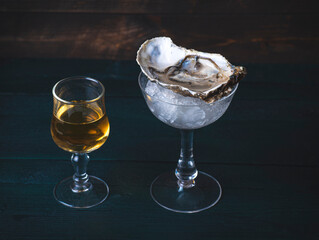 Great Oyster and Whisky combinations. Irish sailor traditions. Man pouring whiskey into an oyster....