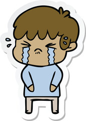 sticker of a cartoon boy crying
