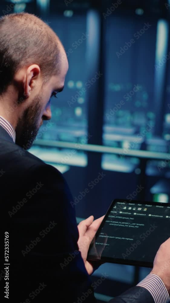 Poster vertical video: it support specialist working with hosting server using tablet in professional data 