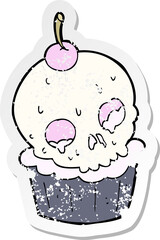 retro distressed sticker of a cartoon halloween cup cake